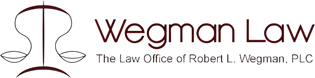 Wegman Law logo with scales illustration.