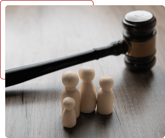 Wooden figures and a judge's gavel symbolizing law and justice.